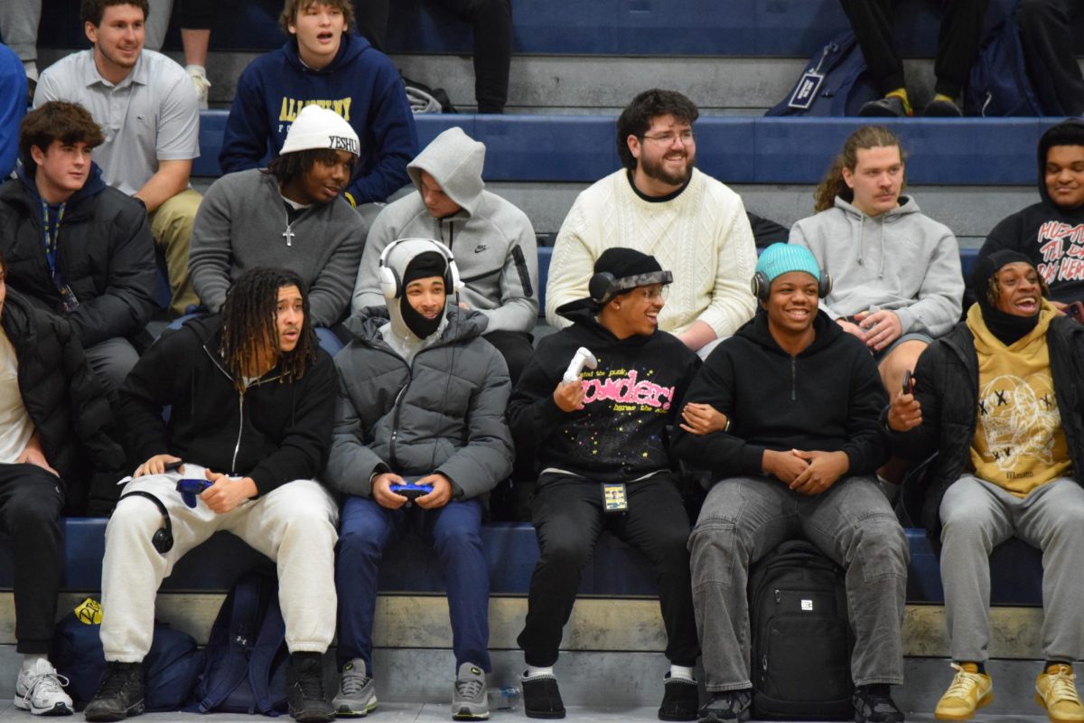 Students assembled on the bleachers in the Wise Center react to the announcement that this year’s Major Events Concert will feature Travis Porter as the opener and Waka Flocka Flame as the headliner.