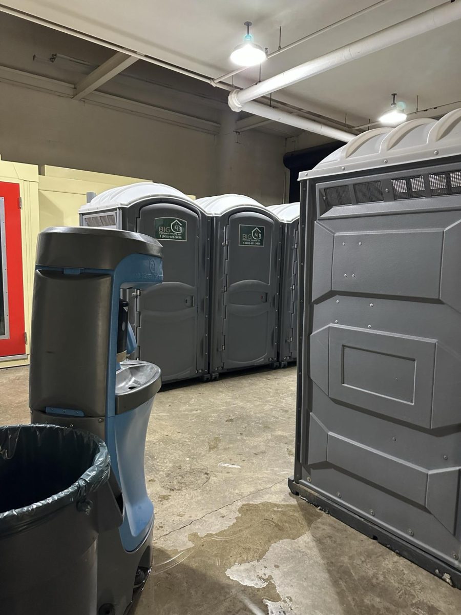 Six portable toilets and two handwashing stations are located in the Arnold Hall of Music.