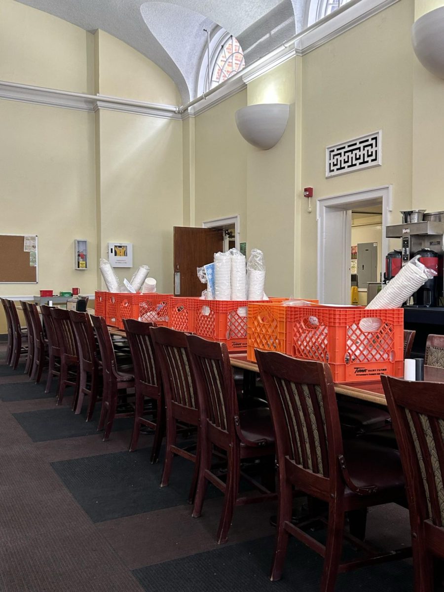 Hot chocolate supplies, prepared by Parkhurst employees to be distributed across campus, sit in crates on a long table in Brooks Dining Hall at 3:30 p.m. on Tuesday, Jan. 27.