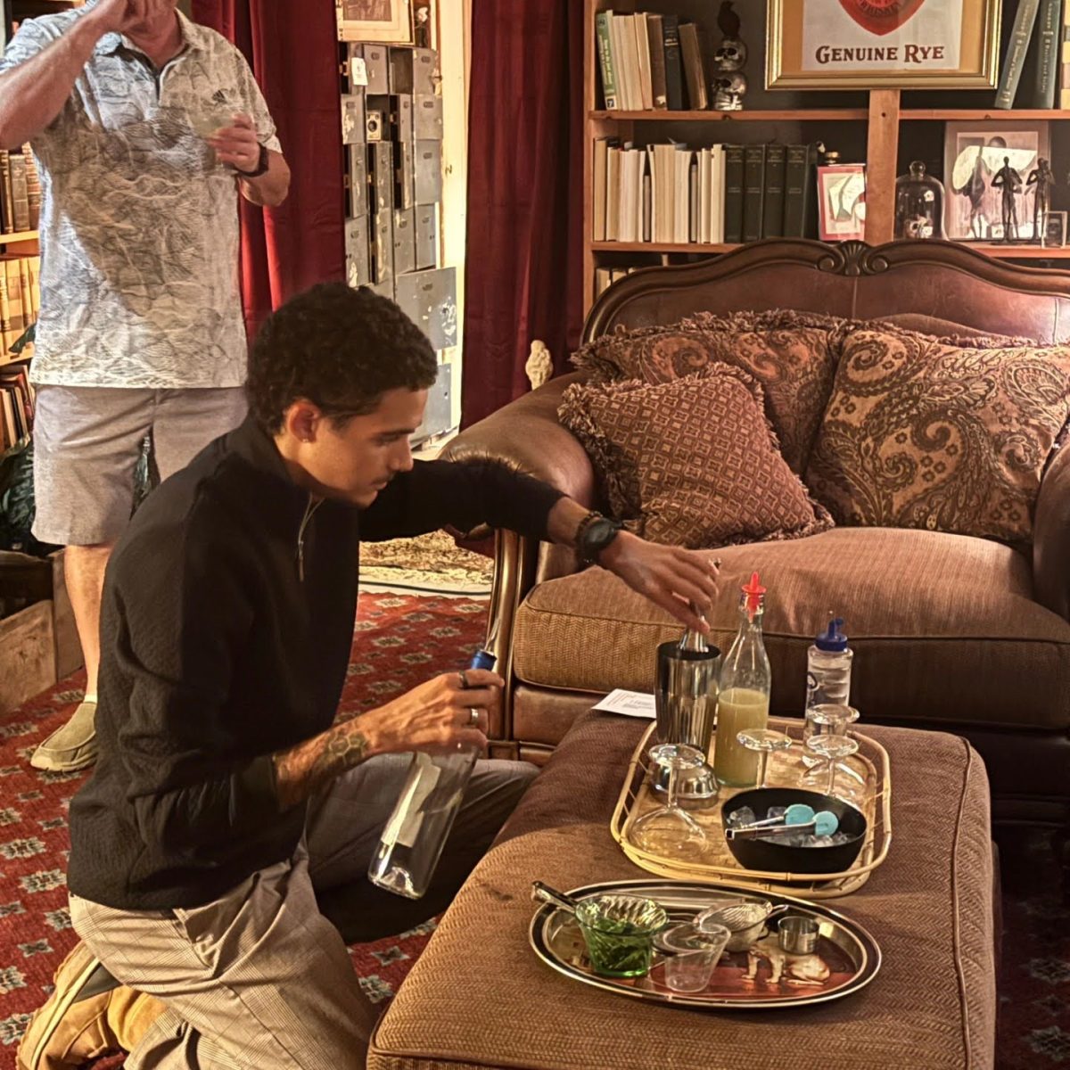 Ian Oliver, ’26, mixes up a mocktail at a class held in The Vault.