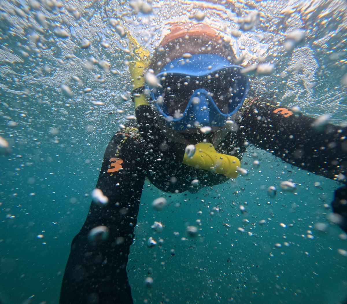 Skye Kramer, ’27, who studied abroad in Australia during the fall 2025 semester, takes a selfie while scuba diving during some of her time off classes.