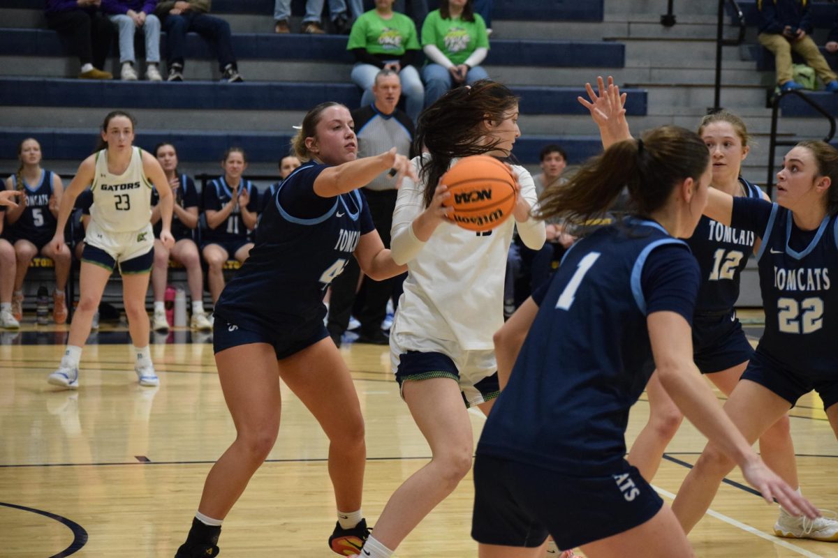 Sarah Santicola, '26, fights through Thiel defenders during the Pride Game in the David V. Wise Center on Wednesday, Feb. 18.