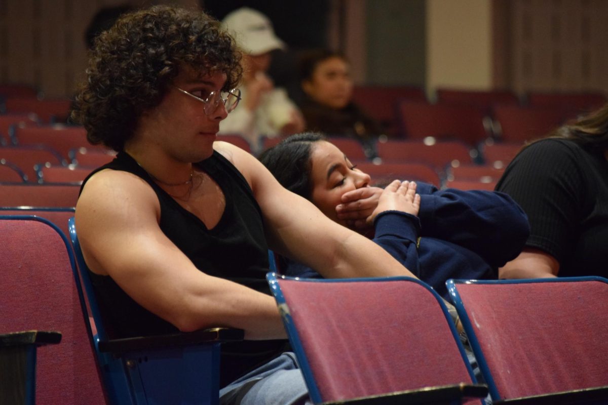 Audience members react to the discussion between the two presidential tickets.