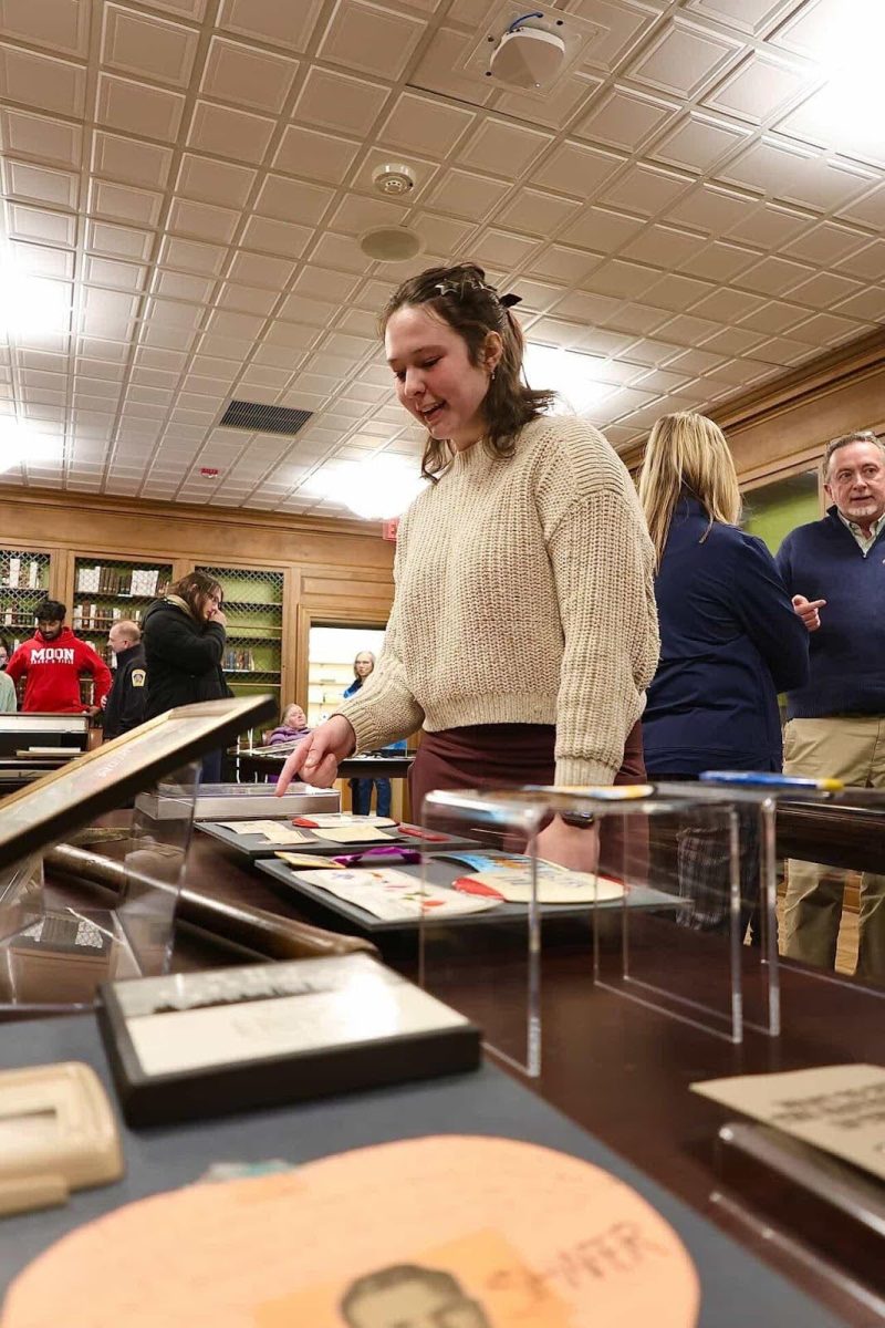 Anna Oros, ’28, an intern in the Wayne and Sally Merrick Historic Archival Center, describes documents from Raymond P. Shafer’s campaign for governor of Pennsylvania at an ‘Out of the Vault’ event on Thursday, March 19.