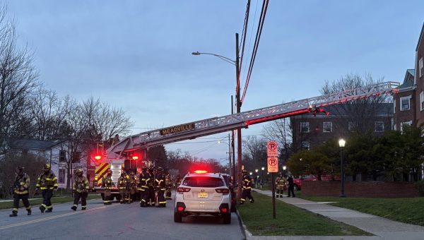 A Meadville fire truck extends an aerial ladder onto the roof of Brooks Dining Hall while responding to a 911 call about a potential structural fire on Sunday, April 12. 
